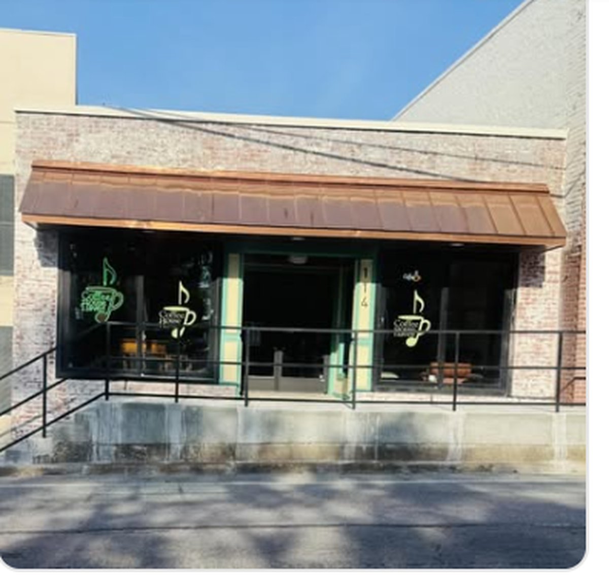 Coffee House Haven storefront at 114 N Main Street in downtown Goodlettsville, TN, with copper awning and coffee-note neon signage